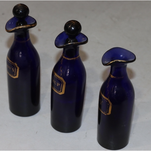 63 - A set of 3 Georgian Bristol blue glass condiment bottles with gilt decoration 