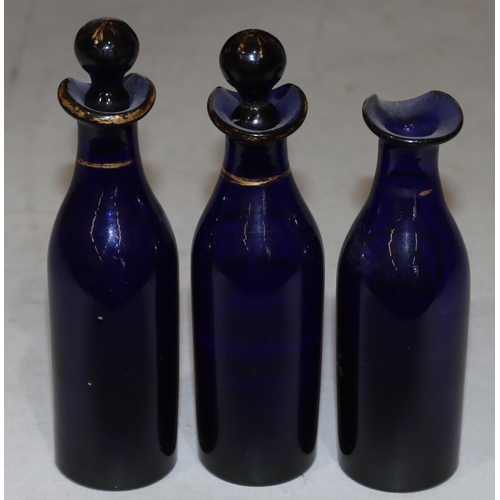 63 - A set of 3 Georgian Bristol blue glass condiment bottles with gilt decoration 