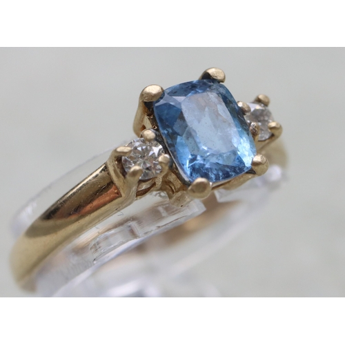 631 - A 9ct gold ring set with centre rectangular aquamarine flanked by 2 small diamonds, Size N, 2.1 gram... 