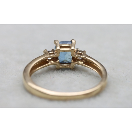 631 - A 9ct gold ring set with centre rectangular aquamarine flanked by 2 small diamonds, Size N, 2.1 gram... 