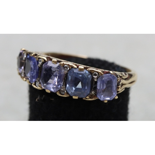 634 - An 18ct gold 5-stone sapphire ring (1 stone altered), Size V, 7.2 grams gross