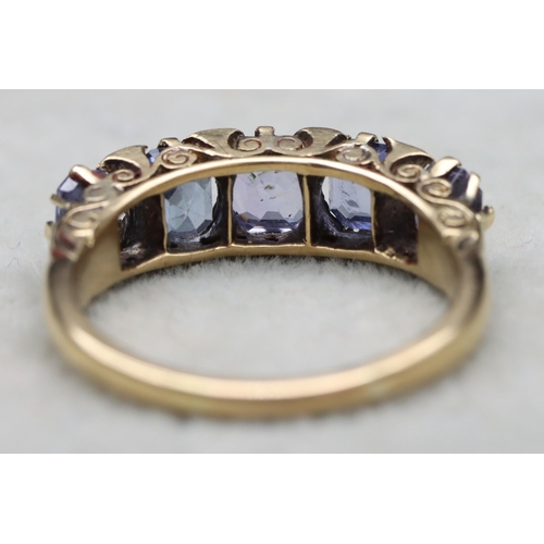 634 - An 18ct gold 5-stone sapphire ring (1 stone altered), Size V, 7.2 grams gross