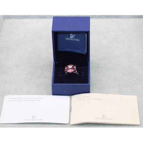 639 - A Swarovski ladies' cluster ring set with clear and pink stones, Size N/O (boxed with certificate)