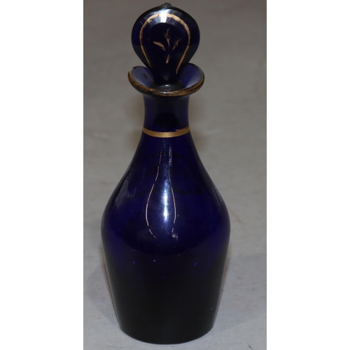 64 - A Georgian Bristol blue glass round bulbous thin necked condiment bottle 