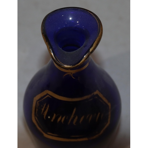 64 - A Georgian Bristol blue glass round bulbous thin necked condiment bottle 