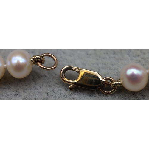 640 - A cultured pearl necklace with 9ct gold clasp, 45cm long (boxed)