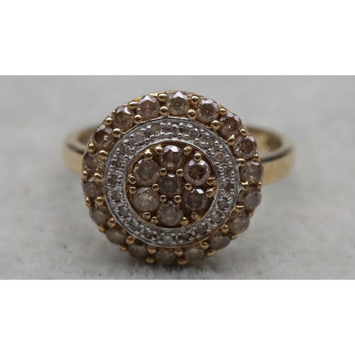 642 - A 9ct gold circular cluster ring with yellow and clear stones, Size O