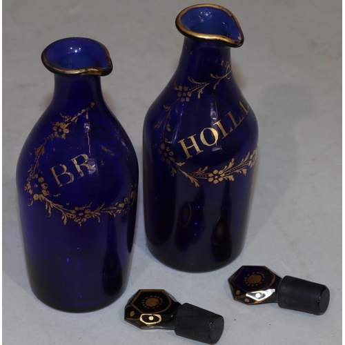 65 - A pair of Georgian Bristol blue glass small round bulbous thin necked spirit decanters with gilt dec... 