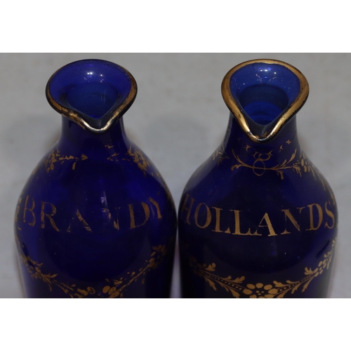 65 - A pair of Georgian Bristol blue glass small round bulbous thin necked spirit decanters with gilt dec... 