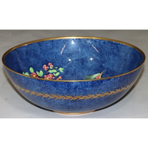 67 - A Royal Winton large round bulbous fruit bowl on blue ground with multi-coloured bird, floral and la... 