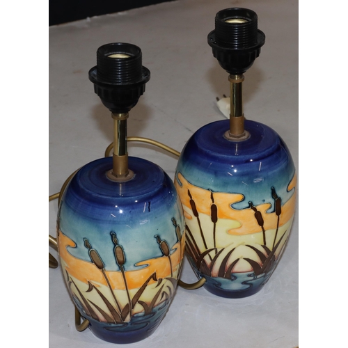 68 - A pair of modern Moorcroft round bulbous shaped table lamps with multi-coloured reeded decoration, 3... 