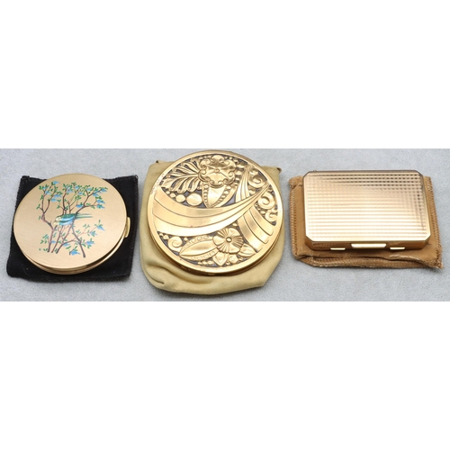 681 - A Stratton gilt metal compact, another circular Stratton gilt metal compact and a circular compact (... 