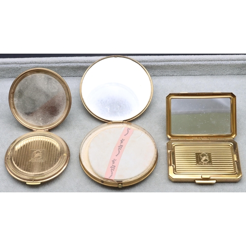 681 - A Stratton gilt metal compact, another circular Stratton gilt metal compact and a circular compact (... 