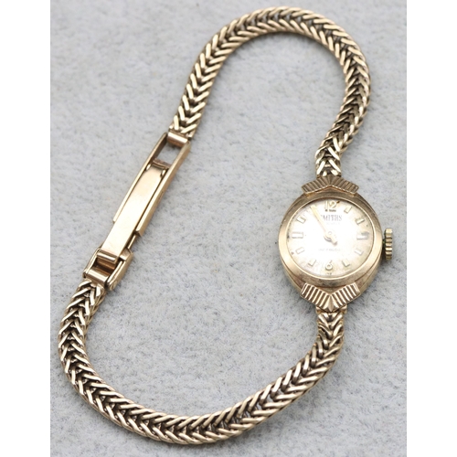 682 - A 9ct gold ladies' Smith's wristwatch with matching strap bracelet (working), 8.6 grams without move... 