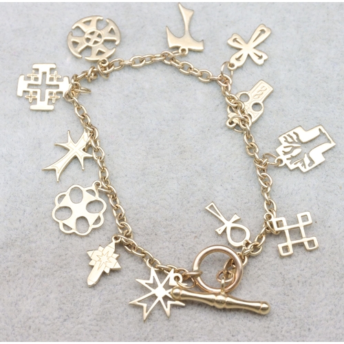 684 - A 9ct gold bracelet with T-bar lock, mounted with 12 charms, 9.1 grams