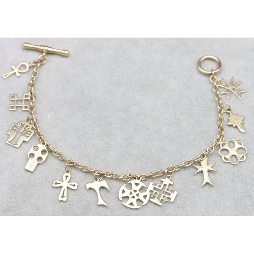 684 - A 9ct gold bracelet with T-bar lock, mounted with 12 charms, 9.1 grams