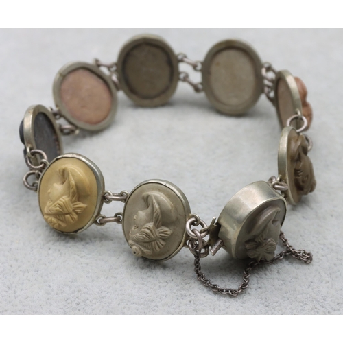 686 - A lava and Continental silver coloured metal bracelet mounted with 9 oval figureheads of ladies