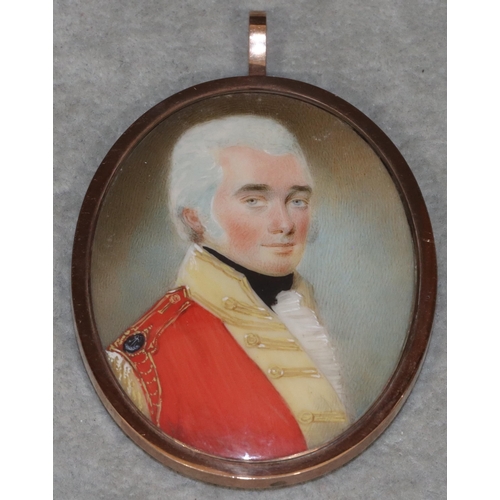 688 - A 19th Century oval gold pendant set with miniature half-length portrait of a Military gentleman, mo... 