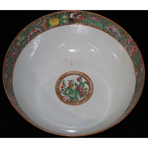 7 - A Cantonese round bowl on white ground with multi-coloured bird, butterfly, floral and leaf decorati... 