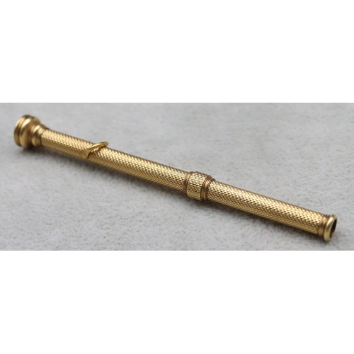 700 - S Morden & Co. gold propelling pencil with allover engine turned decoration and seal motif to top, 9... 