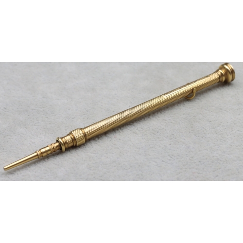 700 - S Morden & Co. gold propelling pencil with allover engine turned decoration and seal motif to top, 9... 