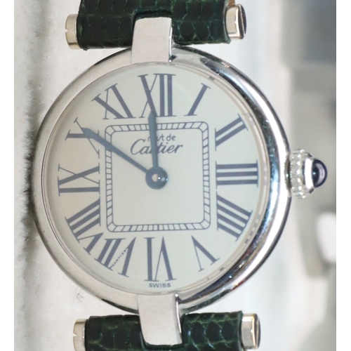 757 - A Must de Cartier ladies' silver circular wristwatch with Roman numerals and green leather strap bra... 