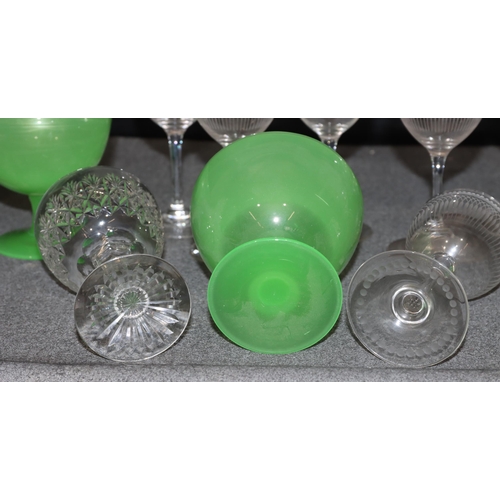 77 - A set of 10 Webb cut crystal glasses, 12cm high, a set of 7 engraved glasses and a pair of green gla... 