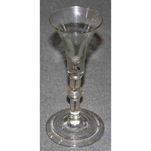 79 - A Georgian plain glass round trumpet shaped cordial glass with knob stem on round sweeping base, 16.... 