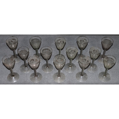 80 - A set of 14 19th/20th Century round trumpet shaped wine glasses with engraved scroll and monogram de... 