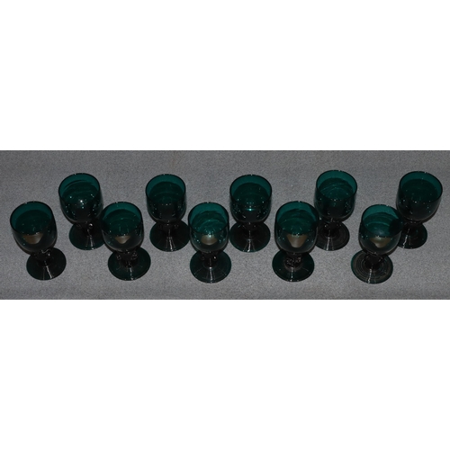 81 - A set of 10 18th/19th Century Bristol green glasses with raised stems on round sweeping bases, 12cm ... 