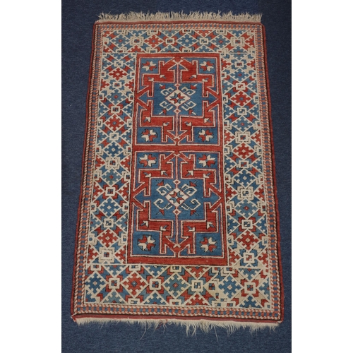 827 - A small Persian rug on white, red and blue ground with 2 box centre medallions, 137cm x 83cm