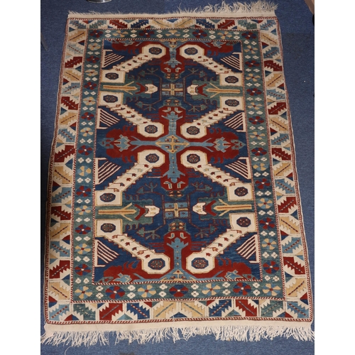 829 - A Persian rug on white, red and blue ground with allover medallions, 194cm x 143cm