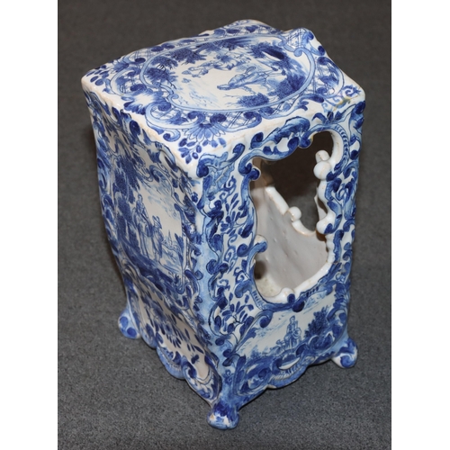 83 - A Continental Delft blue and white ornament in the form of a Sedan chair with allover floral, leaf a... 