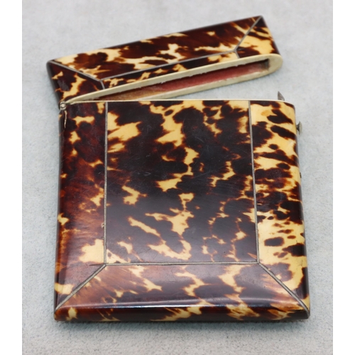 837 - A 19th Century tortoiseshell card case with hinged lid, 10.6cm high, 8cm wide