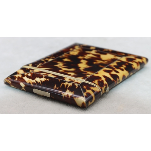 837 - A 19th Century tortoiseshell card case with hinged lid, 10.6cm high, 8cm wide