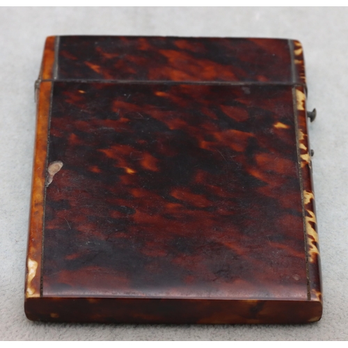 837 - A 19th Century tortoiseshell card case with hinged lid, 10.6cm high, 8cm wide