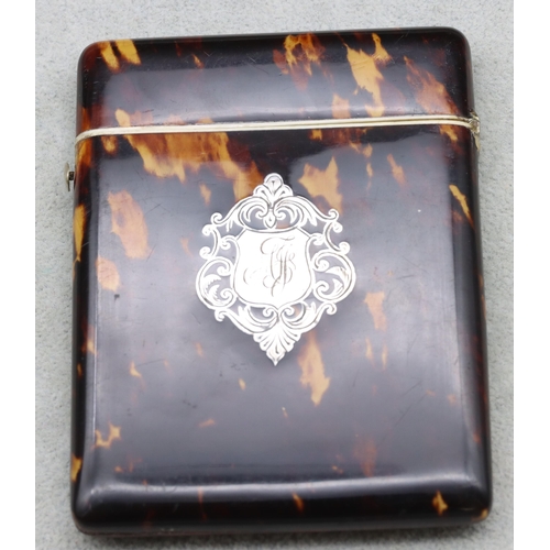 838 - A 19th Century dark tortoiseshell card case with hinged top, 11cm high, 8.3cm wide