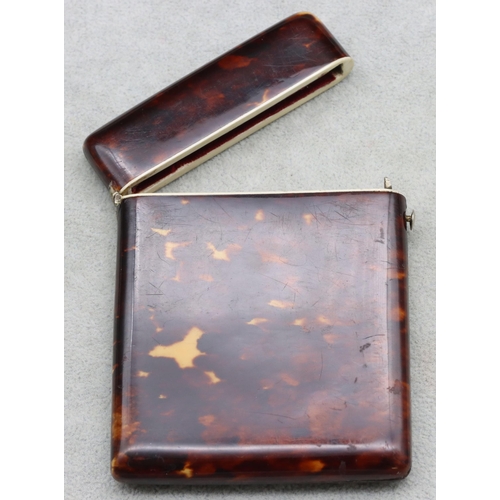 838 - A 19th Century dark tortoiseshell card case with hinged top, 11cm high, 8.3cm wide