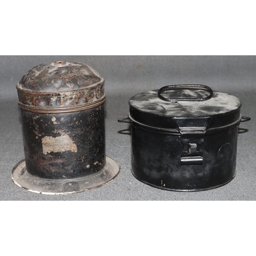 878 - A Caledonian circular railway String tin with cover and sweeping base, 18.5cm high and another black... 