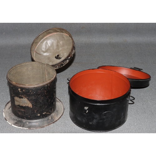 878 - A Caledonian circular railway String tin with cover and sweeping base, 18.5cm high and another black... 