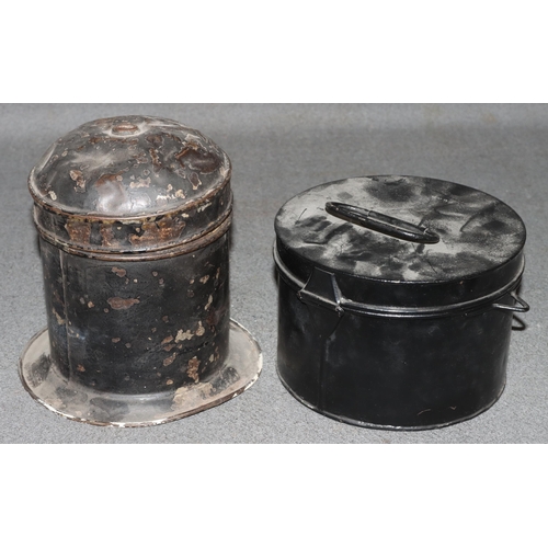 878 - A Caledonian circular railway String tin with cover and sweeping base, 18.5cm high and another black... 