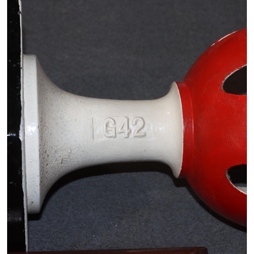 897 - A Railway cast iron red and white painted home signal finial on square base with later wooden base, ... 