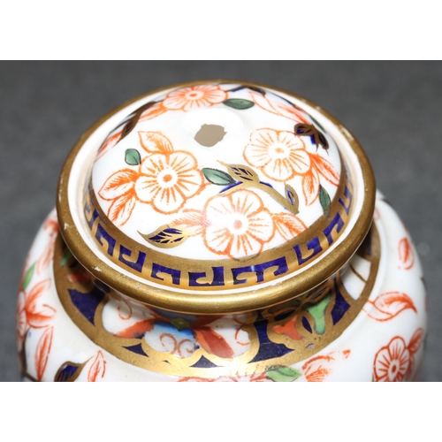 91 - A pair of Derby Imari pattern round bulbous lidded pots (1 finial missing), 13cm high