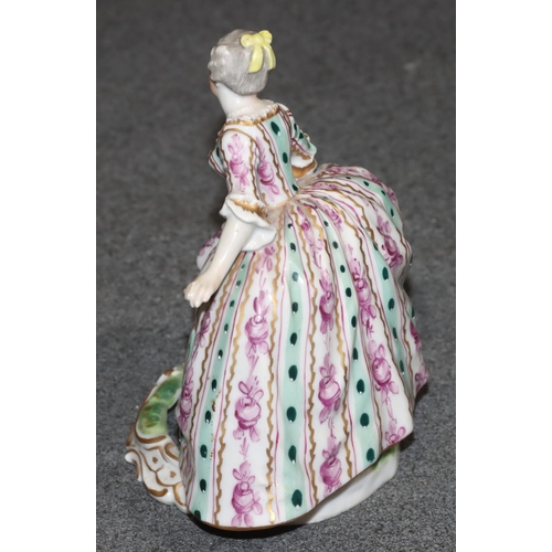 92 - A Vienna porcelain figure of a young lady in sweeping dress on white, green and turquoise ground, 12... 