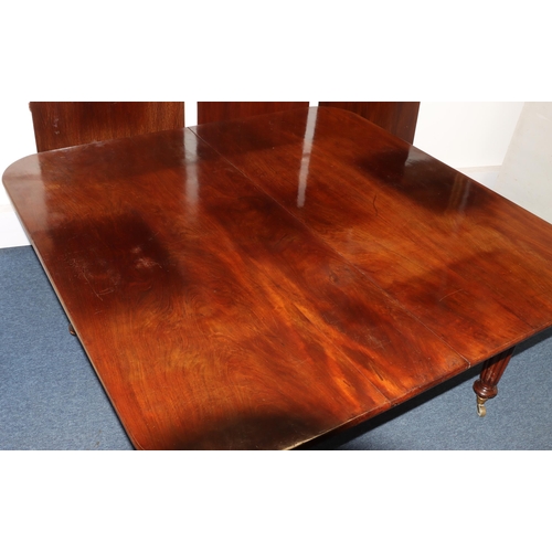 989 - A Large 19th century mahogany key wind dining table with 3 extra leaves (leaves later) 308cm x 146cm... 