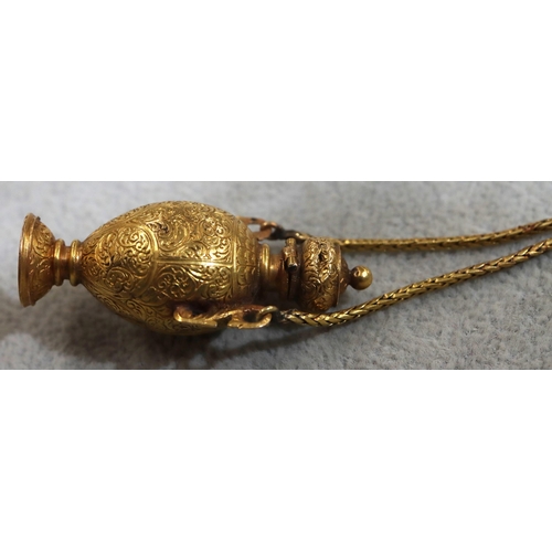 748 - A gold pendant snuff bottle/seal in the form of an urn with hinged lid with allover engraved scroll ... 