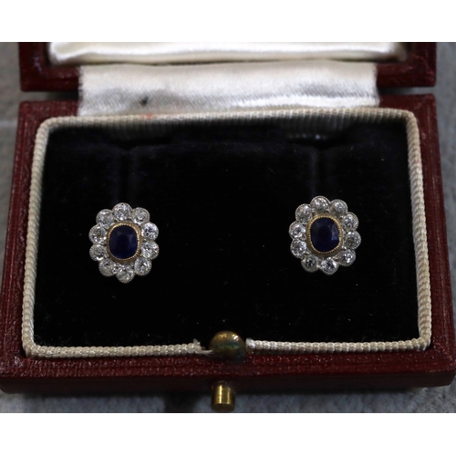 756 - A pair of 9ct gold oval cluster earrings set with centre sapphires, each surrounded by 10 diamonds, ... 