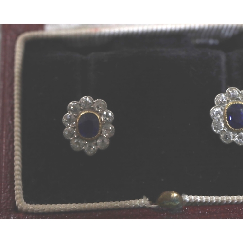 756 - A pair of 9ct gold oval cluster earrings set with centre sapphires, each surrounded by 10 diamonds, ... 