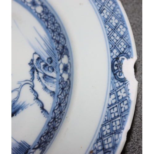 101 - An 18th Century Chinese plate with river landscape decoration on blue and white ground, 23.2cm diame... 