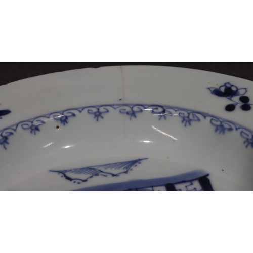 101 - An 18th Century Chinese plate with river landscape decoration on blue and white ground, 23.2cm diame... 